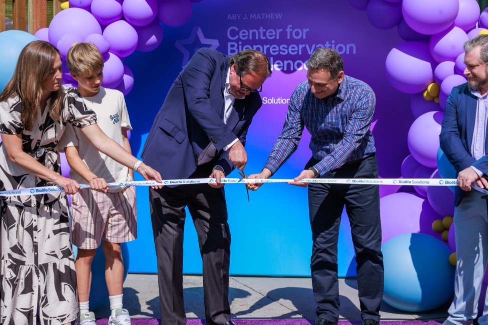 BioLife Solutions leaders, Beau Larrabee, and Betsy Larrabee cut the ribbon at the opening of the Aby J. Mathew Center for Biopreservation Excellence.